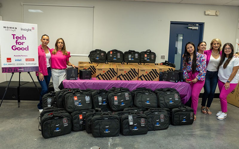 We support the Make-A-Wish Foundation Teammates wearing make a wish shirts kneel with make a wish recipient