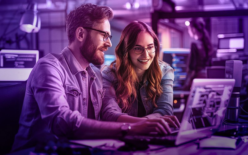 two-users-working-laptop-purple-overlay two-users-working-laptop-purple-overlay