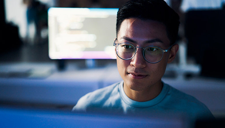 Insight and Cisco Live Webinar Series — Cybersecurity User working on monitor