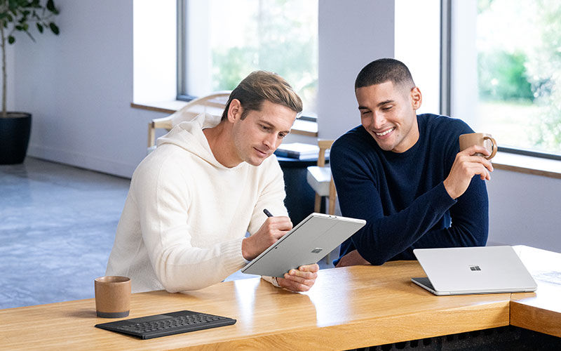 Microsoft hardware solutions Microsoft businessman working on Surface Studio device