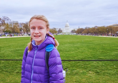 Make-A-Wish wish kid Abbie is in front of the Capitol Building in Washington, D.C.