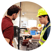 Man with helmet talking to a customer