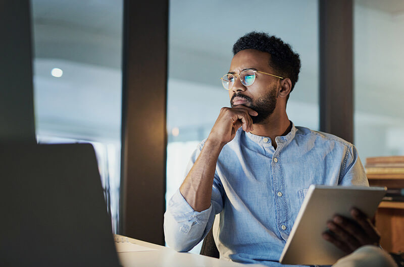 Man using tablet device in office