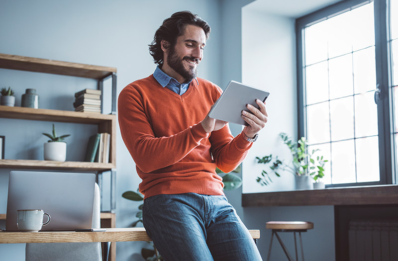 Man using tablet device in office