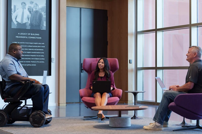 diverse-group-connection-discussion-in-office-lobby Insight teammates meet for general connection