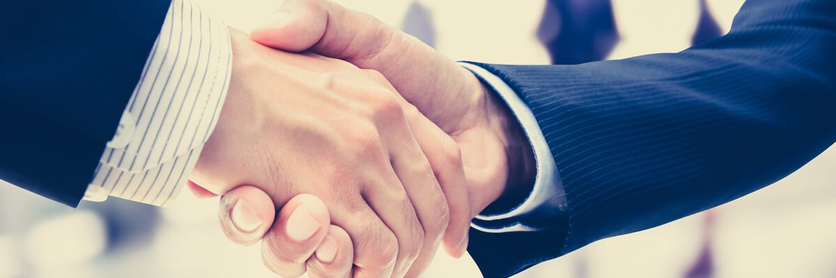 HPE’s Acquisition of SimpliVity: What This Means for Hyperconvergence Two businessmen shaking each other's hands, indicating a merger between HPE and SimpliVity