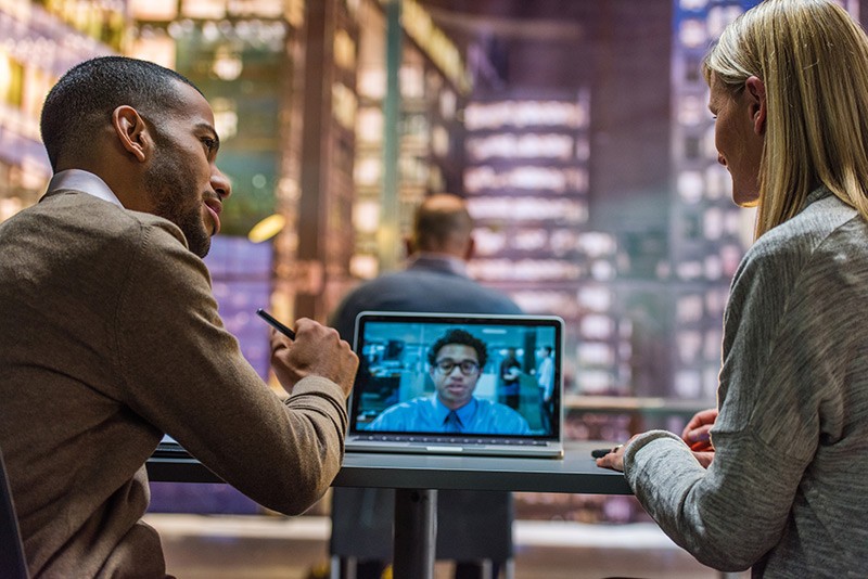 Provide reliable connectivity and clear audio and video communication Business team communicates via video chat during meeting