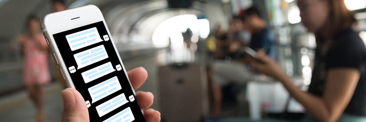 5 Undisputable Reasons to Invest in Chatbot Technology Man messaging a chat bot on his mobile phone