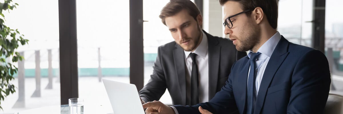 Seven out of 10 financial institutions aren’t spending more than 12% of the overall IT budget on security. Business professional at home calculating cost of new security platform