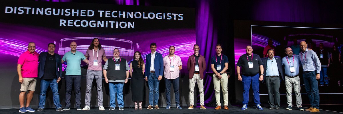 The Distinguished Technologist program nurtures our own company’s strategic direction and enriches our offerings. Distinguished technologists lined up at Insight Mastery 2024 event