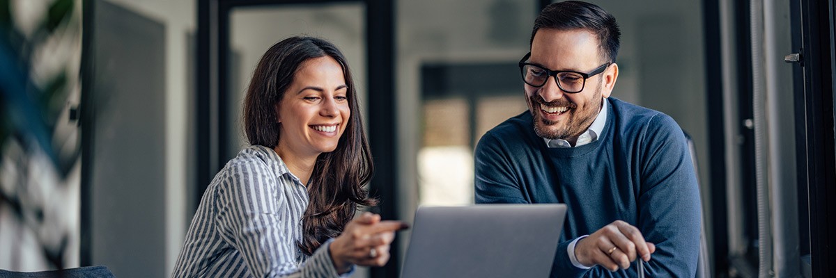 2022 IT Infrastructure Trends to Support Innovation Two users collaborating on laptop