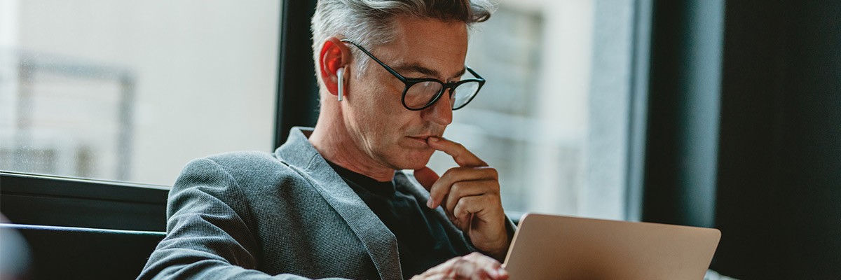 How Security Confidence Fell While Budgets Rose Man using laptop