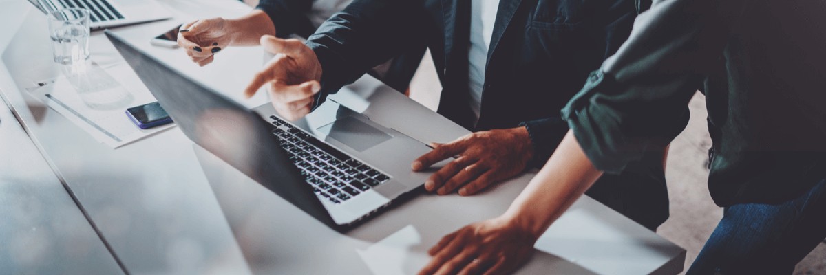 Cybersecurity Advice for Programmatic Guidance Team collaborating around computer