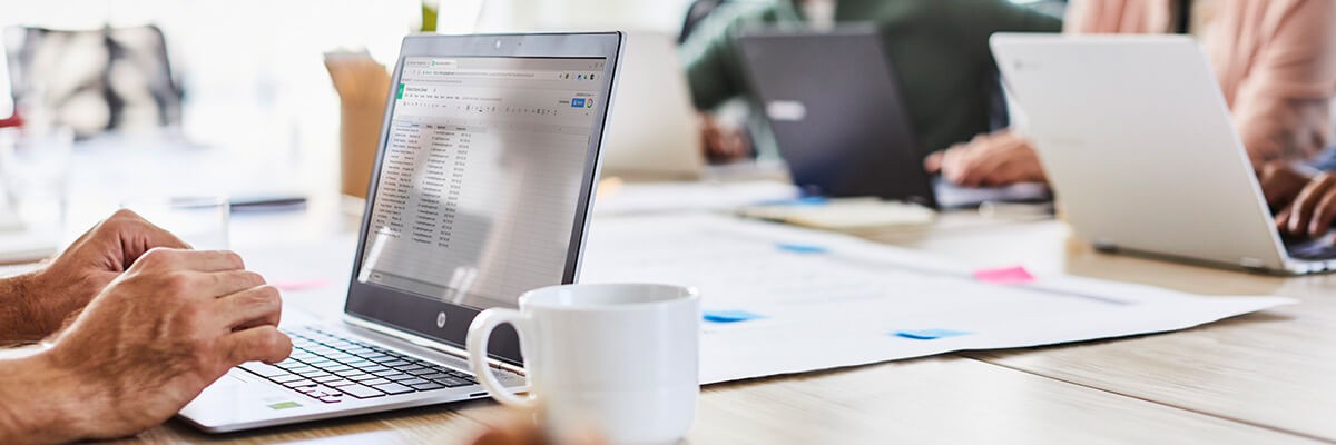 Evolving the IT Approach to a Distributed Workforce Man working on laptop banner