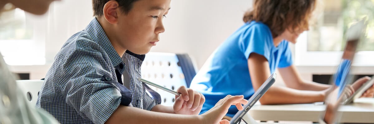 Tranform your K-12 landscape with these key partners Young student on learning device