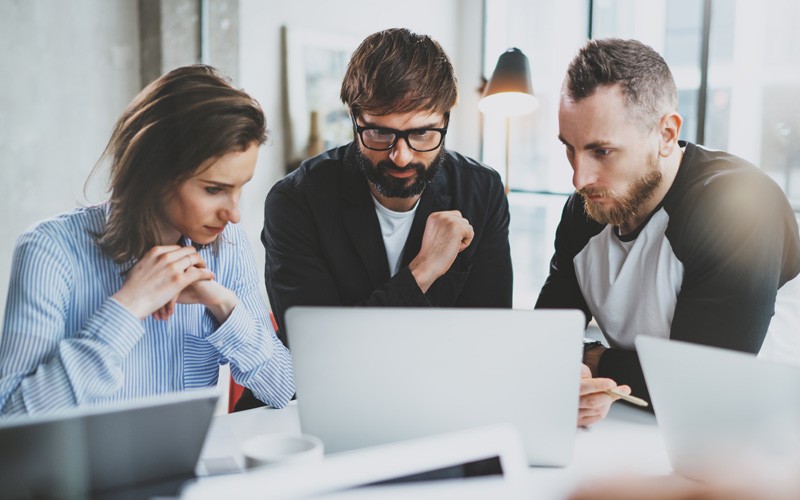 Adobe® Acrobat Pro simplifies and secures document workflows Team working on laptop