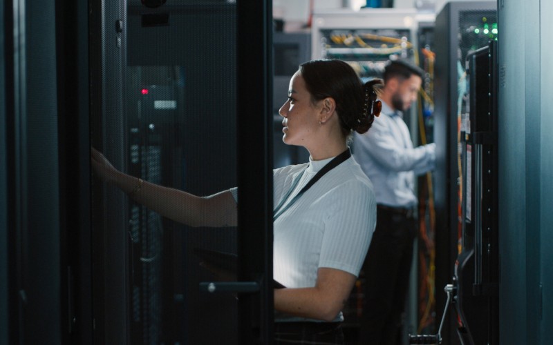 Do more with less and optimize resources Tech team working in server room