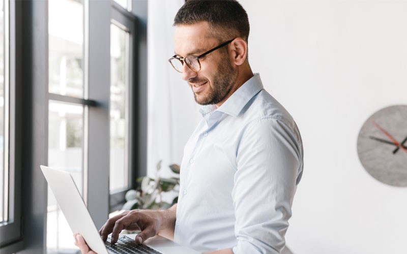 Find the right rack PDU Businessman using laptop computer to view PDU report