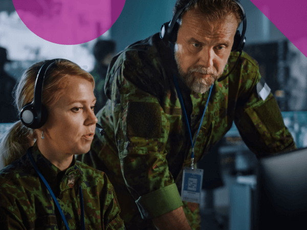 Strengthen your knowledge of Dell PowerEdge server capabilities Two military engineers in facility looking at security insights
