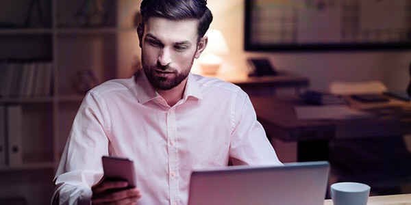 HP Wolf Security contains leading solutions that are built into hardware itself, guaranteeing end-to-end defense Business professional accessing laptop through 3 point verification. HP Wolf Security