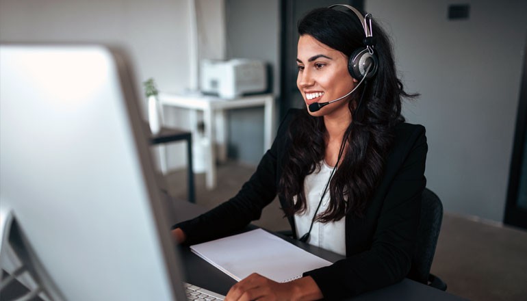 Discover how the enhanced features of Microsoft Defender for Cloud boost your cloud protection Businesswoman with headset works from home