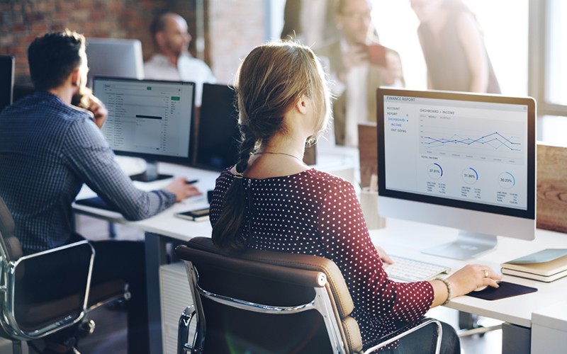 Staff of 2030: Future-Ready Teaching Businesswoman on desktop computer in open office