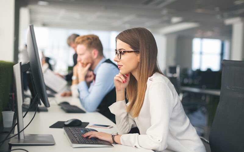 200% increase in malware across supply chains Business woman reading security report