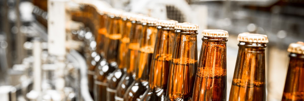 Bottling Enterprise Addresses Network Challenges and Growth Needs Close up of bottles in a distribution center