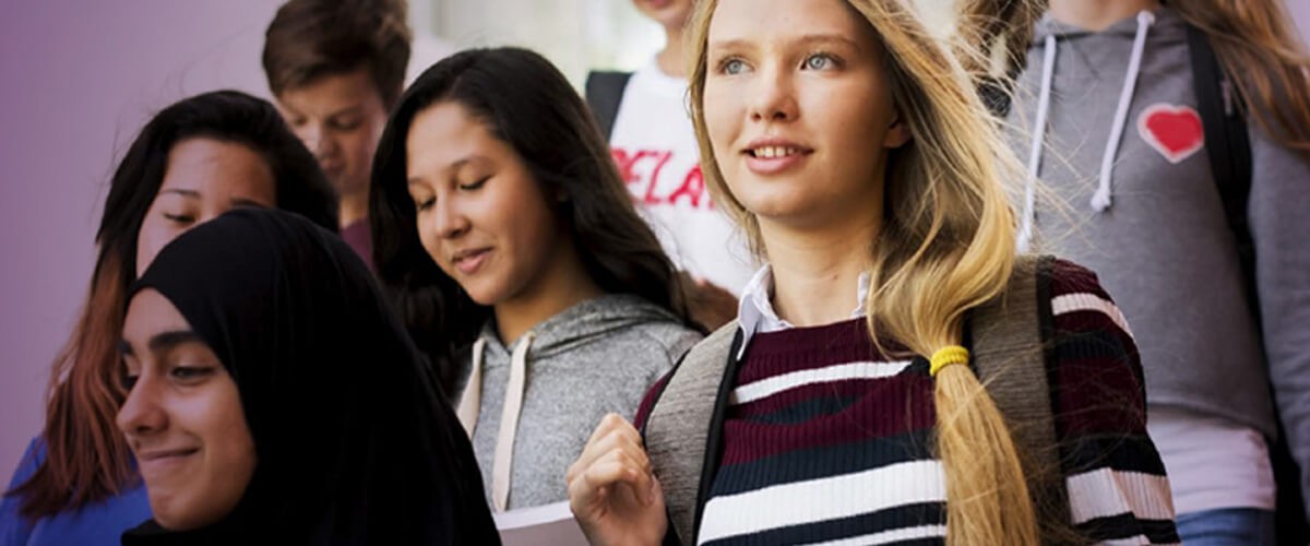 Walthamstow School for Girls educates 900 students across Walthamstow, London. School aged children walking out of class