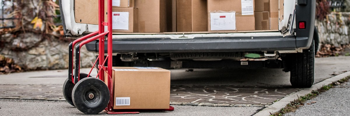 Connecting a Newly Remote Workforce With Secure VPN Close up of delivery van loading up packages