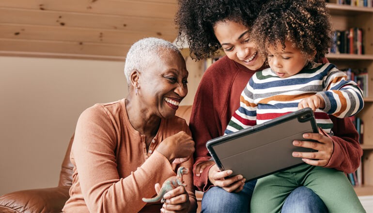 Empower your communities Smart home featuring older adults and grandchildren engaging with technology together