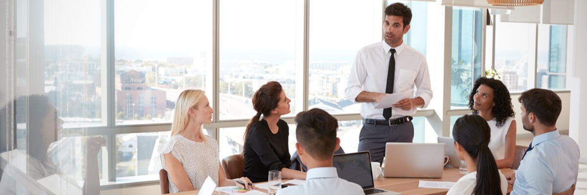 Driving End-User Satisfaction With Apple and VMware People at a company meeting