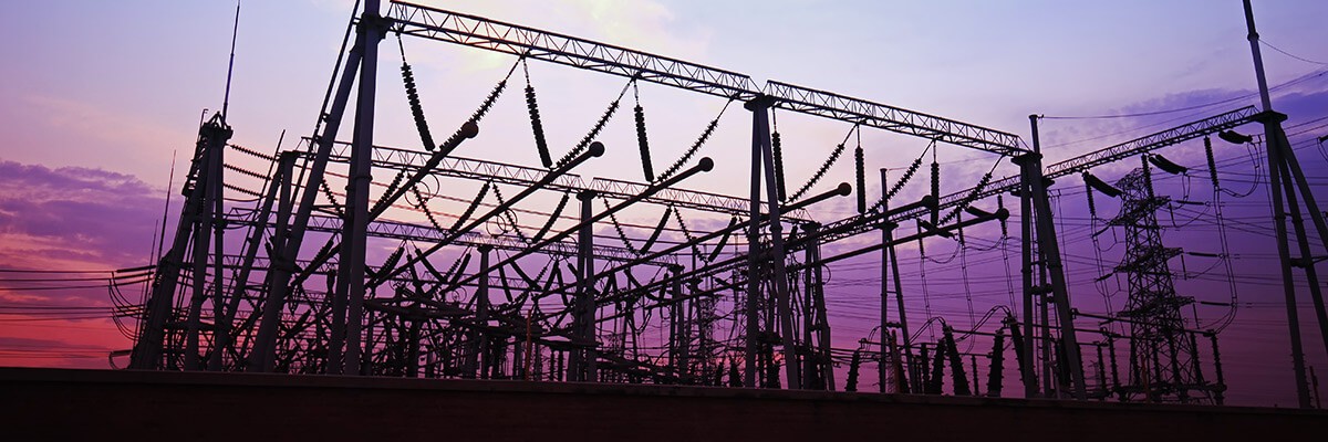 Energy provider saves Cisco for unified messaging Electrical towers with sunset in background