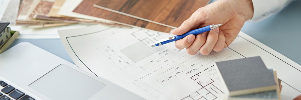 Esteemed, Multinational Architecture Firm Adopts a More Flexible, Cost-Effective Cloud Strategy Close up of architect looking at plans and design choices