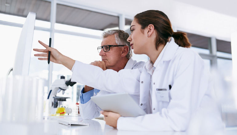 Giles AI Scales Healthcare AI With Insight And Google Cloud Healthcare professional in office on a tablet.