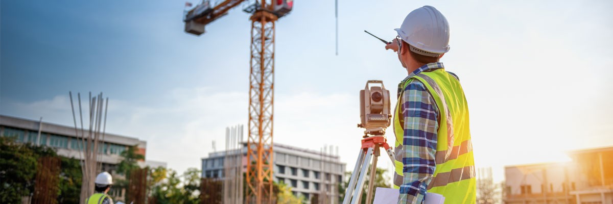 Construction and Development Firm Initiates Insight’s First Instance of Fully Scaled Global Managed Services Two engineers at construction site setting up machinery
