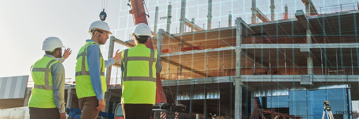 Insight implemented all-new unified communications and networking systems Group of engineers in hard hats overseeing construction onsite