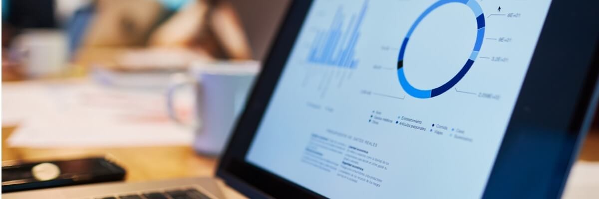close-up-view-of-a-laptop-with-a-business-chart-on-the-screen-cover Close up view of laptop with a business chart on screen cover