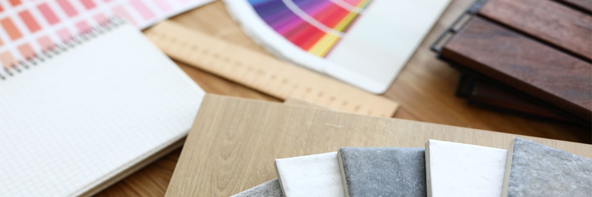 Partner with Insight to find modern, powerful retail tools Close up view of interior design tools, color palette and tile samples