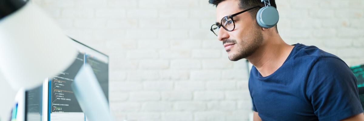 Software Developer Makes a Quick Transition to Remote Work Developer working on devices remotely