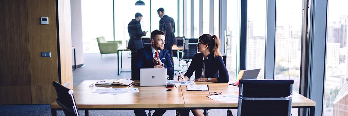 See how partnering with Insight helped elevate their technology systems. Law professionals talking at table. Trading firm, proprietary trading firm, Microsoft, Microsoft CSP, technology, technology systems, cloud, vendor relationship, technology solutions