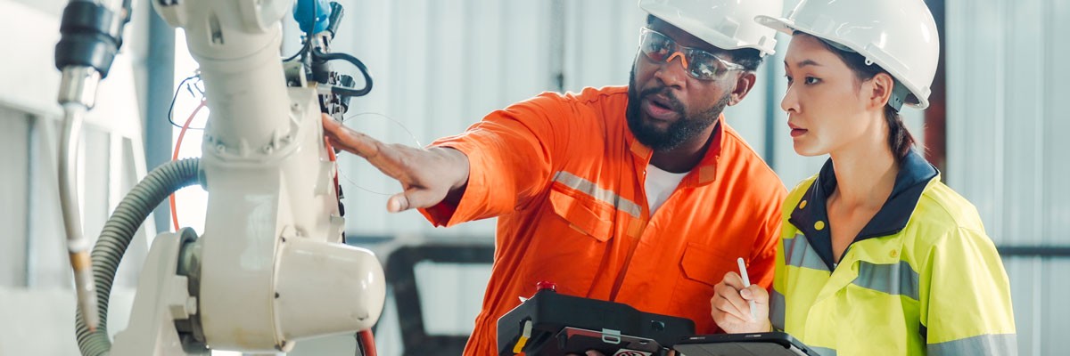A U.S. Manufacturer Recreates a Managed IBM Environment Post-Restructuring Two workers in hard hats on site at a manufacturing facility