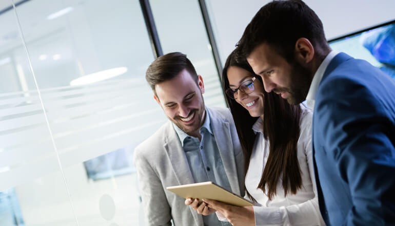 Cisco’s Software Lifecycle Management Through Insight Business team sharing tablet