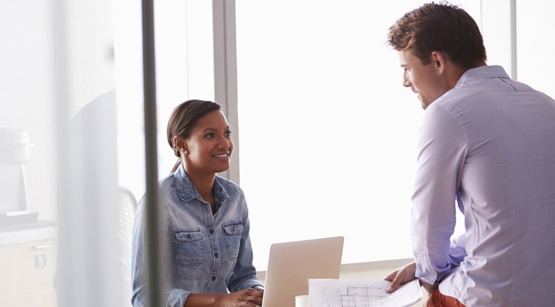 Viewing service as a new business. Two young business people discussing their service.