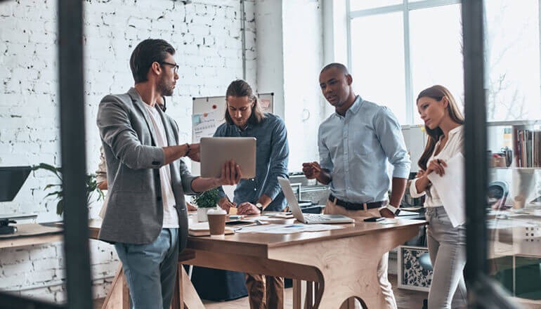 Driving Collaboration to the Enterprise Business colleagues collaborating with the newest technology