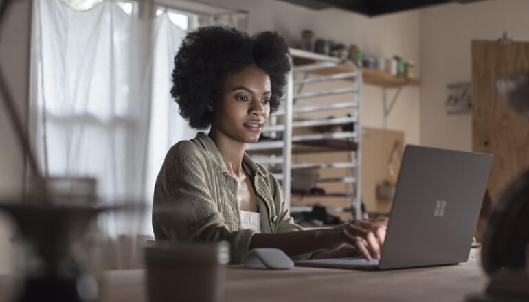 Windows 10 Migration Journey webinar Small business professional using Microsoft Surface Pro with Windows 10