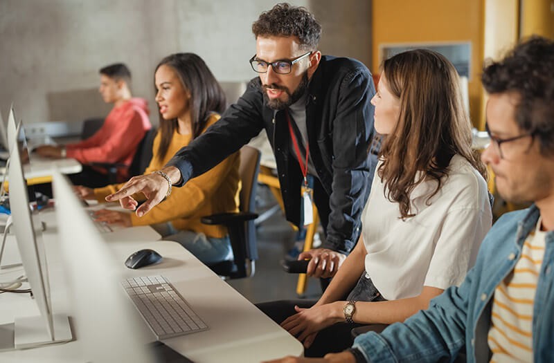 IT security for higher education Students working on technology devices