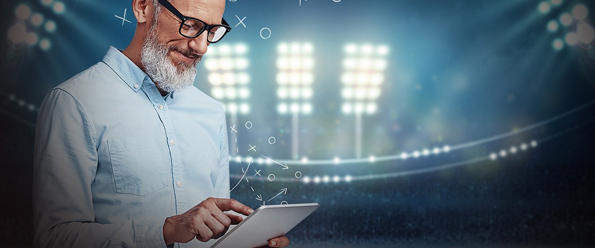 Brand lead story game Man holding ipad in stadium