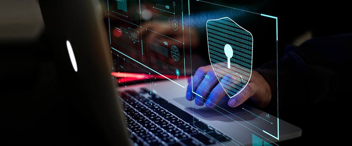 Secure supply chain Hand typing on secure laptop