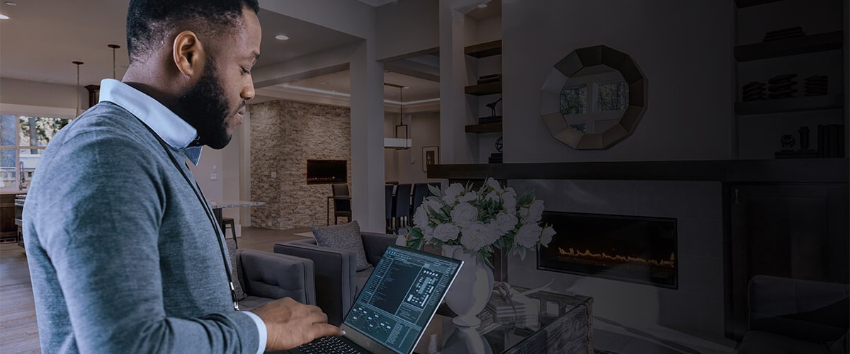 Working From Home (WFH) and Work From Anywhere (WFA) business models will continue in 2021 and beyond. Business professional working off laptop computer at home.